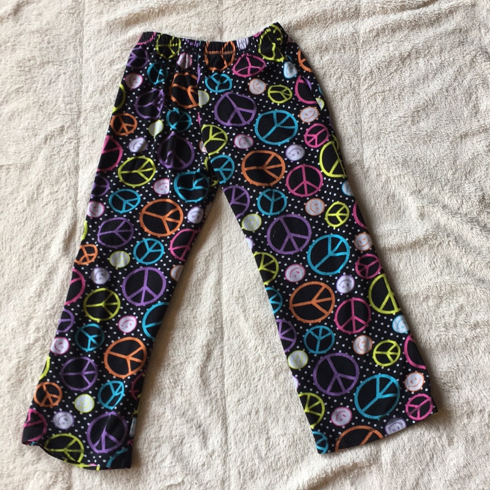 Pajama bottoms with smiley faces and peace signs